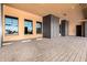 Well-lit garage featuring storage cabinets, windows, and paver flooring, designed for both utility and aesthetic appeal at 21962 E Diana Way, Queen Creek, AZ 85142