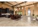 Spacious great room featuring a dining area, grand entrance and travertine flooring at 21962 E Diana Way, Queen Creek, AZ 85142