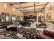 Open great room featuring kitchen, dining area, travertine flooring and high ceilings at 21962 E Diana Way, Queen Creek, AZ 85142