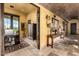 Elegant hallway features travertine floors, brick ceiling, and rustic decor at 21962 E Diana Way, Queen Creek, AZ 85142