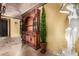 Stylish hallway featuring brick arch ceiling, vintage hutch, and a Grecian statue at 21962 E Diana Way, Queen Creek, AZ 85142