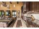 Elegant kitchen featuring an island with a sink and professional-grade stainless steel appliances at 21962 E Diana Way, Queen Creek, AZ 85142