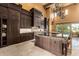 Gourmet kitchen with large island, granite countertops, and premium appliances at 21962 E Diana Way, Queen Creek, AZ 85142