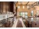Elegant kitchen featuring an island with a sink and professional-grade stainless steel appliances at 21962 E Diana Way, Queen Creek, AZ 85142