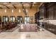 Gourmet kitchen with stone floors, dark wood cabinets, granite counters, and premium appliances at 21962 E Diana Way, Queen Creek, AZ 85142