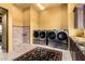Large laundry room with appliances and tile shower at 21962 E Diana Way, Queen Creek, AZ 85142