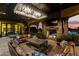 An amazing outdoor living room featuring a fireplace and beautiful seating at 21962 E Diana Way, Queen Creek, AZ 85142