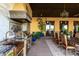 Gourmet outdoor kitchen with copper sink, stainless steel grill, and tiled backsplash at 21962 E Diana Way, Queen Creek, AZ 85142