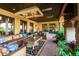 A covered outdoor patio offers comfortable seating, chandelier, and outdoor living at 21962 E Diana Way, Queen Creek, AZ 85142