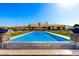 Inviting backyard oasis with a tiled pool, fountains, and elegant landscaping, ideal for relaxation and enjoyment at 21962 E Diana Way, Queen Creek, AZ 85142
