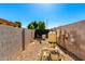 Outdoor pool equipment featuring a pump, filter, and pipes in a gravel-lined enclosure on a sunny day at 21962 E Diana Way, Queen Creek, AZ 85142
