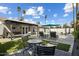 Entertainer's backyard featuring a pool, covered patio, and ample seating space at 2256 S Noche De Paz --, Mesa, AZ 85202