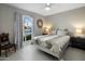 Inviting bedroom featuring a decorative mirror, and a large window with lots of natural light at 2256 S Noche De Paz --, Mesa, AZ 85202