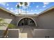 Inviting entryway with an arched facade and desert landscaping that provides privacy and curb appeal at 2256 S Noche De Paz --, Mesa, AZ 85202