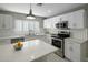 Bright kitchen with white cabinetry, stainless steel appliances, and quartz countertops at 2256 S Noche De Paz --, Mesa, AZ 85202