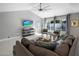 Open concept living room with comfortable seating, TV, and views of the pool at 2256 S Noche De Paz --, Mesa, AZ 85202