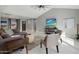 Bright open-concept living room with tile floors, vaulted ceilings, recessed lights, and comfortable contemporary furniture at 2256 S Noche De Paz --, Mesa, AZ 85202