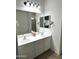 Well-lit bathroom features a double sink vanity and large mirror creating an open feel at 236 N Wesley --, Mesa, AZ 85207