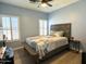 Cozy bedroom with a comfortable bed, shuttered windows, and wood-look floors at 236 N Wesley --, Mesa, AZ 85207