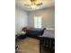 Comfortable bedroom featuring two beds, a ceiling fan, and wood-look flooring at 236 N Wesley --, Mesa, AZ 85207