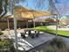 Inviting outdoor area with covered picnic space, grassy areas, and lush landscaping at 236 N Wesley --, Mesa, AZ 85207