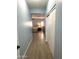 Hallway providing access to a bedroom, with wood floors, and a closet for storage at 236 N Wesley --, Mesa, AZ 85207