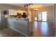 Bright kitchen with stainless steel appliances, tiled floors, and a breakfast bar at 236 N Wesley --, Mesa, AZ 85207