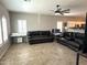 Spacious living room with tile flooring, a ceiling fan, and plenty of natural light from the windows at 236 N Wesley --, Mesa, AZ 85207