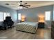 Spacious main bedroom with ceiling fan, desk area, and neutral decor offers a comfortable retreat at 236 N Wesley --, Mesa, AZ 85207