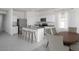 Modern kitchen with granite countertops, stainless appliances, and dining area at 24199 W Hidalgo Ave, Buckeye, AZ 85326