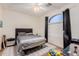 This bedroom features carpet and a modern ceiling fan with light at 2458 E Melrose St, Mesa, AZ 85213