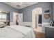 Comfortable bedroom with ensuite bathroom and walk-in closet provides an oasis for relaxation at 2458 E Melrose St, Mesa, AZ 85213