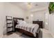Cozy bedroom with dark wood furniture, neutral carpet and ample natural light at 2458 E Melrose St, Mesa, AZ 85213