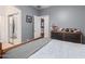 Spacious bedroom with natural light and ensuite bathroom featuring a cozy space with baseball themed decor at 2458 E Melrose St, Mesa, AZ 85213