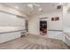 Bright and airy craft room leading to an office, featuring custom cabinets at 2458 E Melrose St, Mesa, AZ 85213