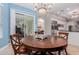 Breakfast nook area with table and view to the kitchen and outdoor patio at 2458 E Melrose St, Mesa, AZ 85213