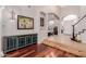 Stylish entryway with hardwood floors, a console table, and an archway leading to other rooms at 2458 E Melrose St, Mesa, AZ 85213