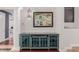 Chic entryway featuring a blue cabinet with glass doors and a decorative map hanging on the wall at 2458 E Melrose St, Mesa, AZ 85213