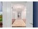 Elegant foyer with a chandelier, arched ceilings, and decorative tile flooring creates a grand entrance at 2458 E Melrose St, Mesa, AZ 85213