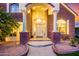 Arched entryway with white pillars leading to front door at 2458 E Melrose St, Mesa, AZ 85213