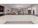 Open-concept kitchen showcasing ample counter space, custom cabinets, and seamless flow to the living area at 2458 E Melrose St, Mesa, AZ 85213