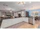 Bright kitchen with a large island, stainless steel appliances, and an adjacent breakfast nook at 2458 E Melrose St, Mesa, AZ 85213