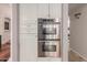 Kitchen with a suite of stainless steel ovens integrated into the cabinetry for modern convenience at 2458 E Melrose St, Mesa, AZ 85213