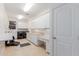 Bright laundry room offers generous cabinet space, sink, washer, and dryer at 2458 E Melrose St, Mesa, AZ 85213
