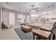 Open-concept living area with a ceiling fan, and seamless flow to kitchen and dining areas at 2458 E Melrose St, Mesa, AZ 85213