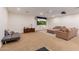 Spacious media room features a drop-down screen and comfortable seating for movie nights at 2458 E Melrose St, Mesa, AZ 85213