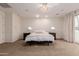 Relaxing main bedroom with a ceiling fan and a private balcony with plenty of natural light at 2458 E Melrose St, Mesa, AZ 85213