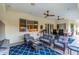 Covered patio with outdoor seating and ceiling fans for comfort at 2458 E Melrose St, Mesa, AZ 85213