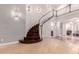 Elegant staircase with wooden steps and white railing, leading to the second floor with recessed lighting at 2458 E Melrose St, Mesa, AZ 85213