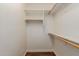 Empty walk-in closet with shelving, rods, and tile flooring ready for storage and customization at 2458 E Melrose St, Mesa, AZ 85213